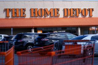 FILE - Shopping carts are parked outside a Home Depot in Philadelphia, Wednesday, Sept. 21, 2022. (AP Photo/Matt Rourke, File)