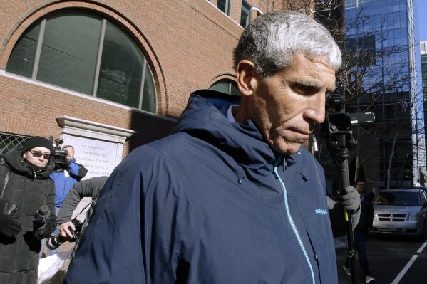 
              William "Rick" Singer founder of the Edge College & Career Network, departs federal court in Boston on Tuesday, March 12, 2019, after he pleaded guilty to charges in a nationwide college admissions bribery scandal. (AP Photo/Steven Senne)
            