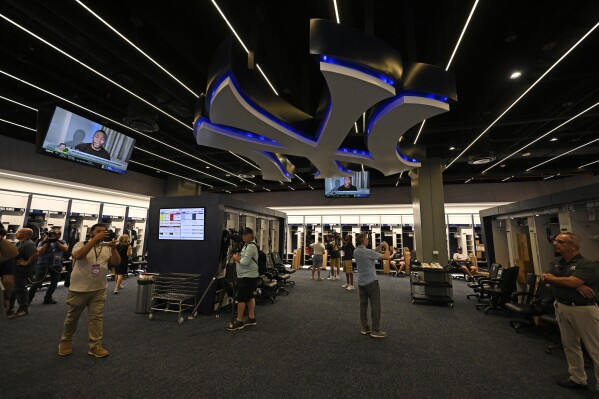 Members of the media look around the New York Yankees clubhouse during a tour of the upgraded team spring training facilities Thursday, Feb. 13, 2025, at George M. Steinbrenner Field in Tampa, Fla. (AP Photo/Steve Nesius, File)