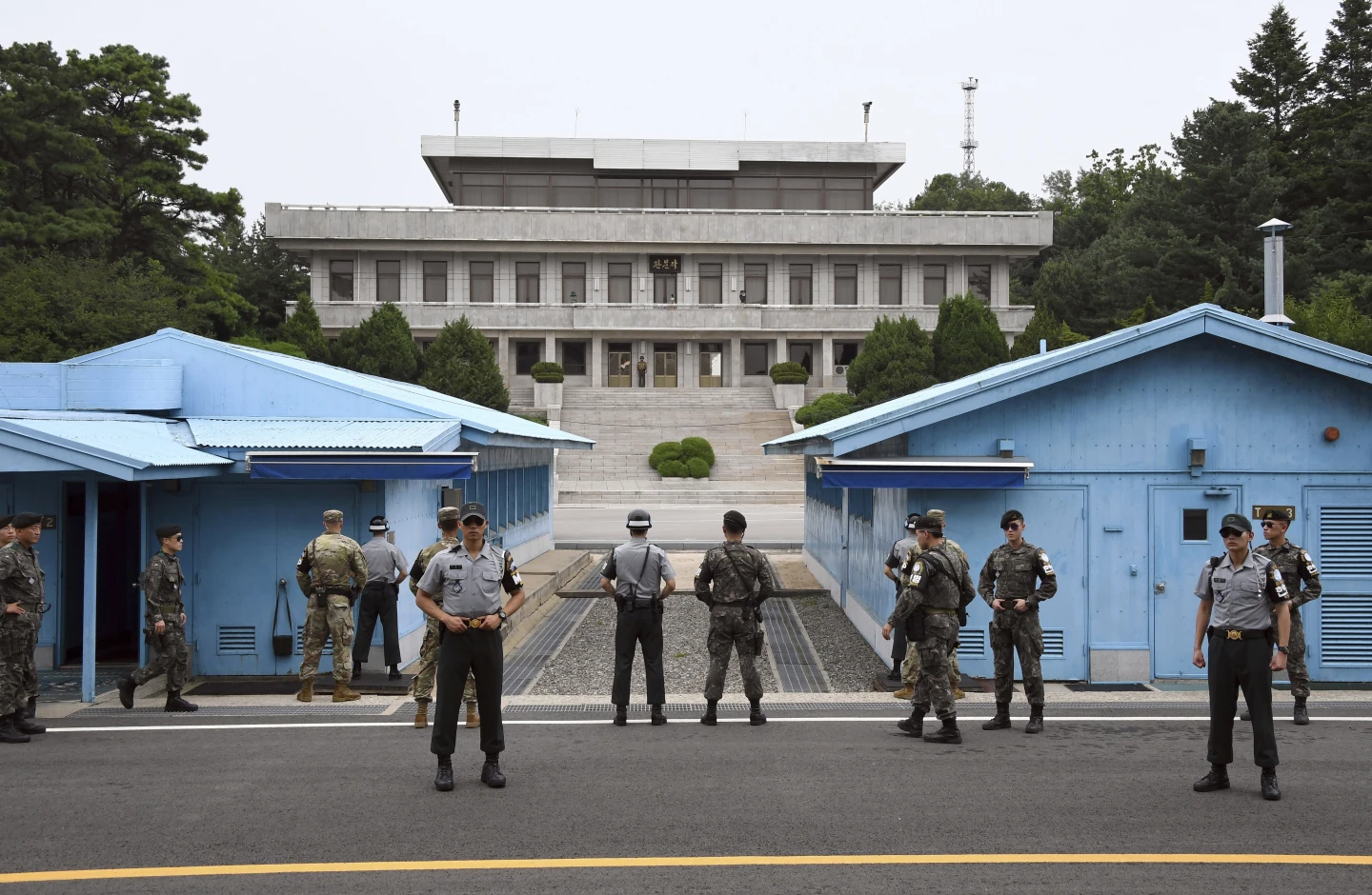 An American soldier who had spent nearly two months in a South Korean prison defected across the heavily guarded border into North Korea