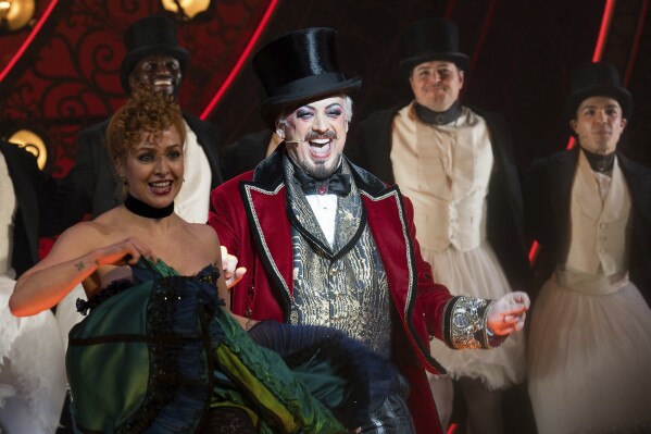 Boy George, center, is pictured on stage during the curtain call for his debut performance in "Moulin Rouge! The Musical" at the Al Hirschfeld Theatre on Tuesday, Feb. 6, 2024, in New York. (Photo by Evan Agostini/Invision/AP)