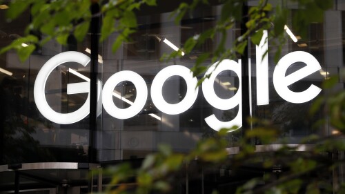 FILE - The Google logo is displayed at their offices, Nov. 1, 2018, in London. Google says, Thursday, July 20, 2023, it is in the early stages of developing artificial intelligence tools to help journalists write stories and headlines, and has discussed its ideas with leaders in the news industry. (AP Photo/Alastair Grant, File)