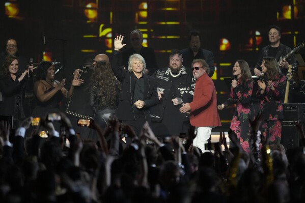 Brandy Clark, from left, The War and Treaty, Shania Twain, Jon Bon Jovi, Jelly Roll, Sammy Hagar, Rebecca Lovell, and Megan Lovell of Larkin Poe perform during MusiCares Person of the Year honoring Jon Bon Jovi on Friday, Feb. 2, 2024, in Los Angeles. (AP Photo/Chris Pizzello)