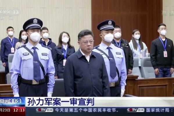 In this image taken from video footage run by China's CCTV, Sun Lijun, former vice minister of public security, attends a court sentencing in Changchun in northeastern China's Jilin province on Friday, Sept. 23, 2022. The former deputy Chinese police minister who was accused of leading a crime gang of government officials was given a death sentence with a two-year reprieve Friday on charges of manipulating the stock market, taking bribes and other offenses, state TV reported Friday, Sept. 23, 2022 (CCTV via AP)