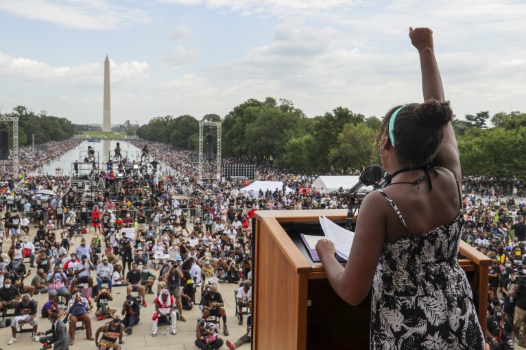 FILE - Yolanda Renee King, granddaughter of the Rev. Martin Luther King Jr., raises her fist as she speaks during the March on Washington, Friday Aug. 28, 2020, in Washington, on the 57th anniversary of the Rev. Martin Luther King Jr.'s "I Have A Dream" speech. (Jonathan Ernst/Pool via AP, File)
