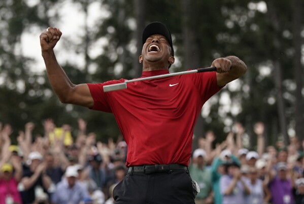 In this April 14, 2019, file photo, Tiger Woods reacts as he wins the Masters golf tournament at Augusta National in Augusta, Ga. (AP Photo/David J. Phillip, File)