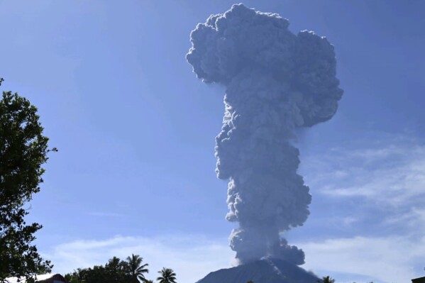 In this photo released by the Vulcanology and Geological Disaster Mitigation Center of the Indonesian Ministry of Energy and Mineral Resources (PVMBG-ESDM), Mount Ibu spews volcanic materials into the air during an eruption in West Halmahera, Indonesia, Monday, May 13, 2024. The volcano in Indonesia's North Maluku province, erupted on Monday, spewing thick grey ash and dark clouds 5,000 meters (16,400 feet) into the sky for five minutes, officials said. (PVMBG-ESDM via AP)