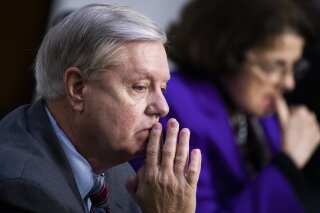 Sen. Lindsey Graham, R-S.C., listens during the confirmation hearing for Supreme Court nominee Amy Coney Barrett, before the Senate Judiciary Committee, Thursday, Oct. 15, 2020, on Capitol Hill in Washington. (Tom Williams/Pool via AP)