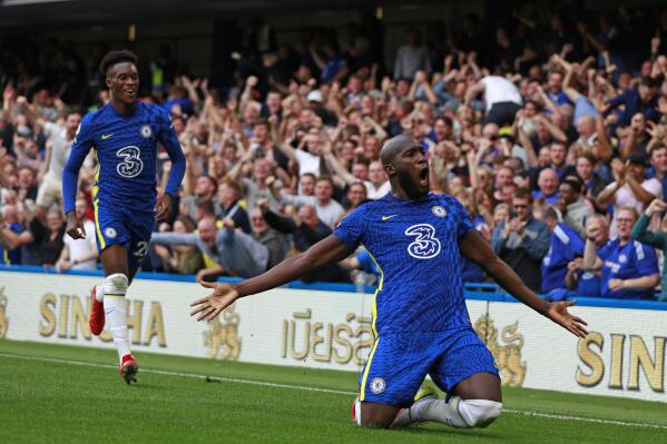 Chelsea's Romelu Lukaku, right, celebrates after scoring his side's opening goal during the English Premier League match between Chelsea and Aston Villa at the Stamford Bridge Stadium in London, Saturday, Sept. 11, 2021. (AP Photo/Ian Walton)