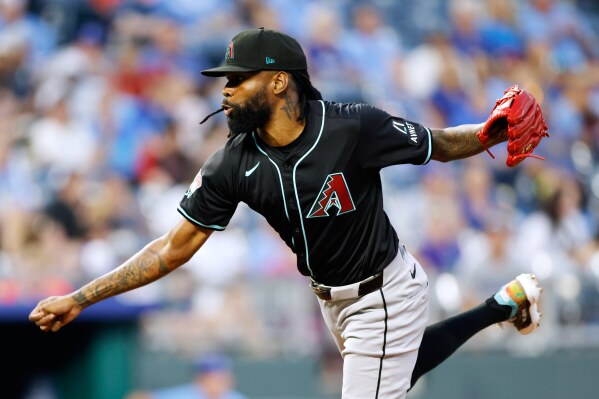 Arizona Diamondbacks reliever Miguel Castro follows through on a pitch to Kansas City Royals batter Bobby Witt Jr. during the fourth inning of a baseball game in Kansas City, Mo., Monday, July 22, 2024. (AP Photo/Colin E. Braley, file)