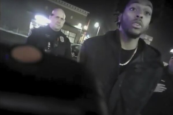 FILE - This Jan. 26, 2018, file photo showing police body-camera footage released by Milwaukee Police Department shows NBA Bucks guard Sterling Brown talking to arresting police officers after being shot by a stun gun in a Walgreens parking lot in Milwaukee. Milwaukee city officials are offering Sterling Brown $400,000 to settle his lawsuit accusing police of using excessive force and targeting him because he's black when they confronted him over a parking violation. The city's Common Council authorized the offer Wednesday, Sept. 4, 2019, during a closed session. Brown has 14 days to accept or decline it. (Milwaukee Police Department via AP, File)