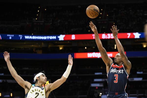 Washington Wizards guard Bradley Beal (3) shoots against Indiana Pacers guard Andrew Nembhard, left, during the first half of an NBA basketball game Saturday, Feb. 11, 2023, in Washington. (AP Photo/Nick Wass)