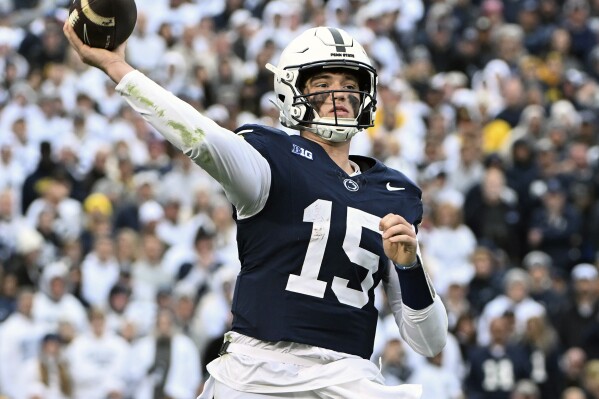 FILE - Penn State quarterback Drew Allar passes against Michigan during the second half of an NCAA college football game Nov. 11, 2023, in State College, Pa. Mississippi will play for the first 11-win season in school history when the Rebels of the Southeastern Conference, led by quarterback Jaxson Dart, face Penn State, led by Allar, in the Peach Bowl, Saturday, Dec. 30, 2023. (AP Photo/Barry Reeger, File)