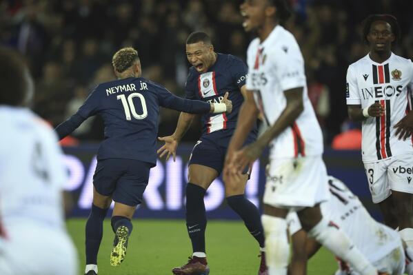 PSG's Kylian Mbappe, centre right, celebrates after scoring his side's second goal during the French League One soccer match between Paris Saint-Germain and Nice at the Parc des Princes in Paris, Saturday, Oct. 1, 2022. (AP Photo/Aurelien Morissard)