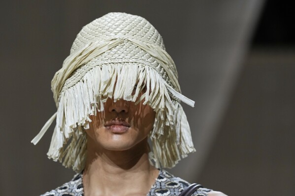 A model wears a creation as part of the men's Emporio Armani Spring-Summer 2026 collection, that was presented in Milan, Italy, Saturday, June 21, 2025. (AP Photo/Luca Bruno)
