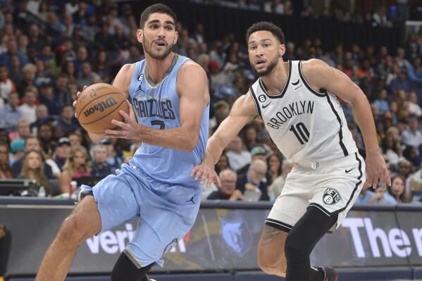 Memphis Grizzlies forward Santi Aldama (7) handles the ball against Brooklyn Nets guard Ben Simmons (10) in the second half of an NBA basketball game Monday, Oct. 24, 2022, in Memphis, Tenn. (AP Photo/Brandon Dill)