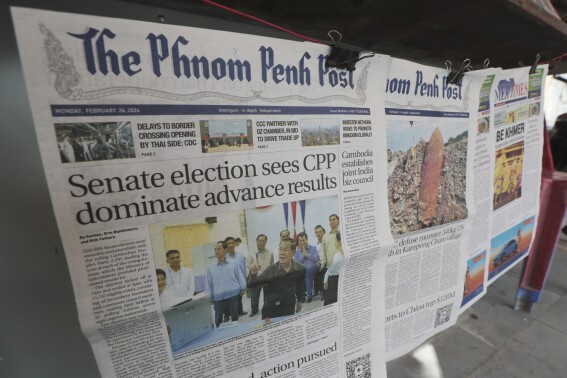 Local newspapers the Phnom Penh Post, left, and Khmer Times, right, are for sale at a newspaper's stand on a sidewalk near Monument Independence in Phnom Penh, Cambodia, Friday, Mach 1, 2024. The Phnom Penh Post, a newspaper founded in 1992 as Cambodia sought to re-establish stability and democracy after decades of war and unrest, announced Friday that it will cease publishing a print edition this month, the latest blow to the country's dwindling independent media. (AP Photo/Heng Sinith)