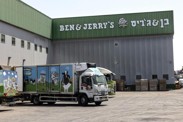 Truck are parked at the Ben & Jerry's ice-cream factory in the Be'er Tuvia Industrial area, Tuesday, July 20, 2021. Israeli Prime Minister Naftali Bennett told the head of Unilever on Tuesday that Israel will "act aggressively" against Ben & Jerry's over the subsidiary's decision to stop selling its ice cream in the Israeli-occupied West Bank and contested east Jerusalem. (AP Photo/Tsafrir Abayov)