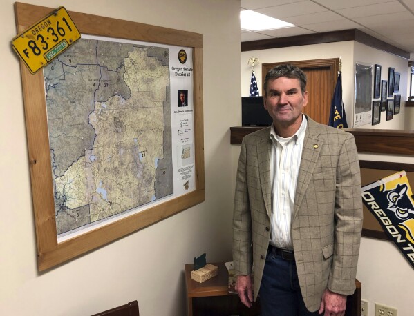 FILE - Oregon state Sen. Dennis Linthicum, R-Klamath Falls, poses in his office in the Oregon State Capitol in Salem, Ore., on Feb. 8, 2019. A federal judge on Wednesday, Dec. 13, 2023, rejected a request from Oregon Republican state senators who boycotted the Legislature to be allowed on the ballot after their terms end. State Sens. Dennis Linthicum, Brian Boquist and Cedric Hayden filed the federal lawsuit to challenge their disqualification from running for reelection under Measure 113. (AP Photo/Andrew Selsky, File)