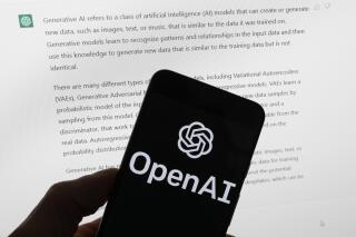FILE - The OpenAI logo is seen on a mobile phone in front of a computer screen displaying output from ChatGPT, on March 21, 2023, in Boston. The Italian government’s privacy watchdog said Friday March 31, 2023 that it is temporarily blocking the artificial intelligence software ChatGPT in the wake of a data breach. (AP Photo/Michael Dwyer, File)