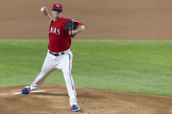 Texas Rangers startr Kyle Gibson pitches in the first inning of the team's baseball game against Tampa Bay Rays in Arlington, Texas, Friday, June 4, 2021. (AP Photo/Andy Jacobsohn)