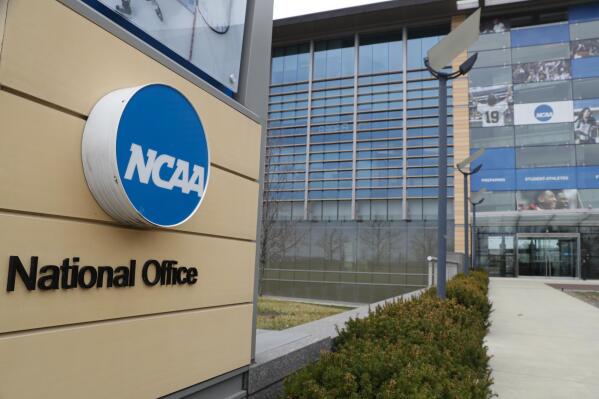 FILE - This is a March 12, 2020, file photo showing NCAA headquarters in Indianapolis. The NCAA and many of its student-athletes are closely watching a court case in Pennsylvania that could determine whether Division I athletes should be paid for their time in the same way students are paid for work-study jobs. (AP Photo/Michael Conroy, File)