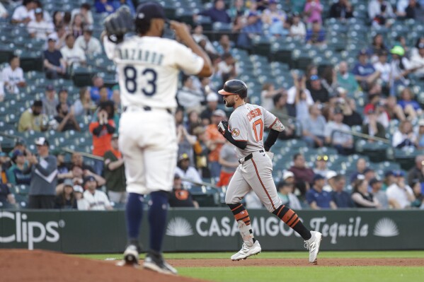 Baltimore Orioles' Colton Cowser jogs the bases after hitting a home run off Seattle Mariners pitcher Eduard Bazardo (83) during the sixth inning of a baseball game, Tuesday, June 3, 2025, in Seattle. (AP Photo/Jason Redmond)