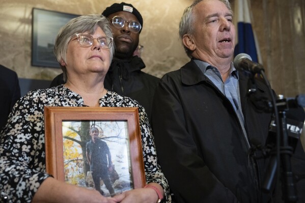 The family of Tekle Sundberg, including parents Cindy and Mark, speak during a press conference inside the Ramsey County Courthouse in Saint Paul, Minn., on Thursday, Nov. 16, 2023. The families of five Minnesota men who were killed by law enforcement officers have announced a lawsuit to force the Bureau of Criminal Apprehension to release its investigative files on their deaths, saying the state agency has failed to comply with Minnesota’s open records law. (Shari L. Gross/Star Tribune via AP)