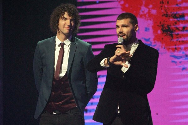 FILE - Joel Smallbone, right, and Luke Smallbone of For King and Country appear at the 47th Annual GMA Dove Awards in Nashville, Tenn. on Oct. 11, 2016. The brother duo earned their first artist of the year award at the Gospel Music Association’s Dove Awards, which aired on Friday, Oct. 30, 2020, without an audience due to the COVID-19 pandemic. (Photo by Wade Payne/Invision/AP, File)
