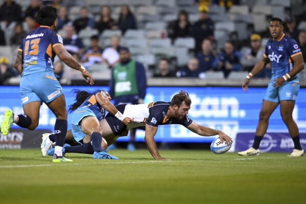 Hudson Creighton of the Brumbies scores a try during the Super Rugby Pacific Round 5 match between the ACT Brumbies and Moana Pasifika in Canberra, Friday, March 22, 2024. (Lukas Coch/AAP Image via AP)