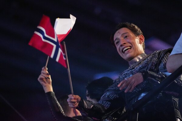Kyle Alessandro from Norway who performed the song "Lighter" celebrates after progressing through first semi-final to the final of the 69th Eurovision Song Contest, in Basel, Switzerland, Tuesday, May 13, 2025. (AP Photo/Martin Meissner)