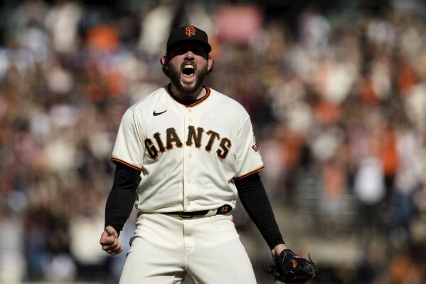 San Francisco Giants closing pitcher Dominic Leone reacts after defeating the San Diego Padres in a baseball game in San Francisco, Sunday, Oct. 3, 2021. The Giants won the National League West title. (AP Photo/John Hefti)