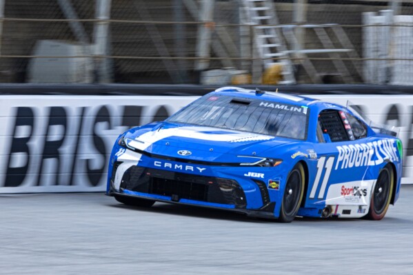 Denny Hamlin (11) goes down the back stretch during a NASCAR Cup Series auto race, Sunday, April 13, 2025, in Bristol, Tenn. (AP Photo/Wade Payne)