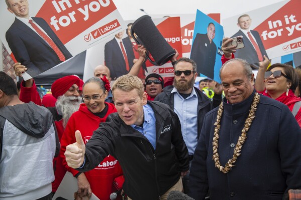 New Zealand Prime Minister Chris Hipkins, center, gestures during a campaign visit to Otara markets in Auckland, New Zealand, on Aug. 19, 2023. New Zealand lawmakers rushed to pass legislation and criticize opponents during a rowdy final day of the nation’s 53rd Parliament. With an election looming in six weeks, lawmakers will now switch their focus to the campaign trail. (Sylvie Whinray/New Zealand Herald via AP)