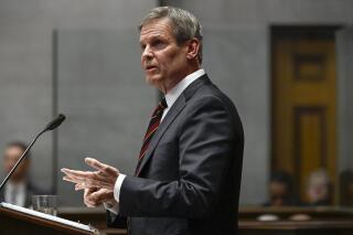 FILE - Tennessee Gov. Bill Lee delivers his State of the State Address in the House Chamber on Feb. 6, 2023, in Nashville, Tenn. Lee's roads funding push to allow express toll lanes on some highways and fee increases on drivers with electric or hybrid vehicles cleared a key legislative vote on Monday, March 20, 2023. (AP Photo/Mark Zaleski, File)