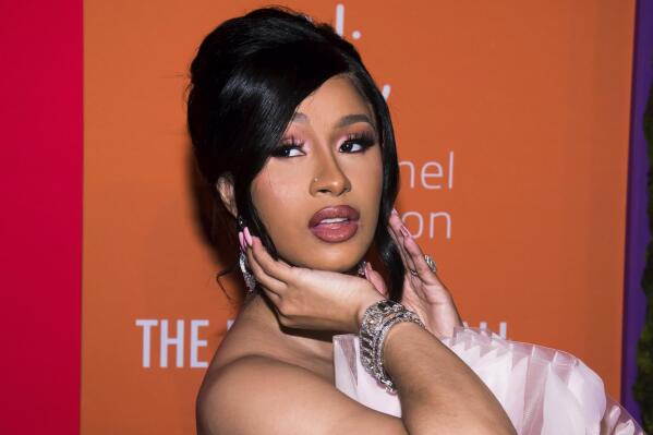 FILE - Cardi B appears at the 5th annual Diamond Ball benefit gala at Cipriani Wall Street in New York on Sept. 12, 2019. The Grammy-winning rapper resolved a yearslong criminal case stemming from a pair of brawls at New York City strip clubs by pleading guilty Thursday in a deal that requires her to perform 15 days of community service.  (Photo by Mark Von Holden/Invision/AP, File)