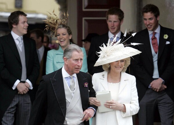 Britain's Prince Charles, and Camilla, Duchess of Cornwall, leave the Guildhall, Windsor, Saturday, April 9, 2005, following their civil wedding ceremony. (Peter Tarry, Pool Photo via AP, File)
