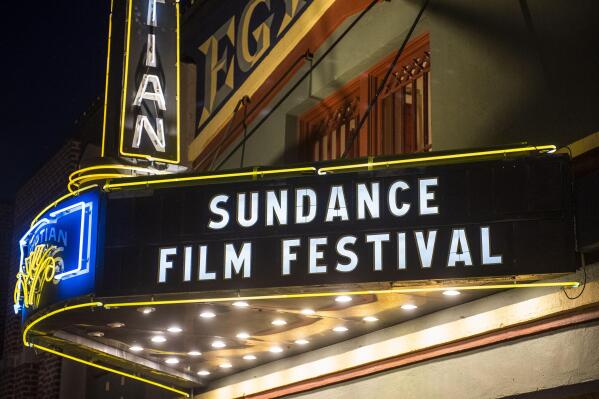 FILE - The marquee of the Egyptian Theatre appears during the Sundance Film Festival in Park City, Utah on Jan. 28, 2020. After two years of virtual editions, the Sundance Film Festival is returning to Park City, Utah armed with a robust slate of diverse features and documentaries that will premiere over 10 days beginning on Thursday, Jan. 19. (Photo by Arthur Mola/Invision/AP, File)