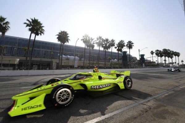 IndyCar driver Simon Pagenaud, from Montmorillon, France, makes the turn onto Seaside Way from Pine Avenue during the final practice session at the Acura Grand Prix of Long Beach, Saturday, Sept. 25, 2021, in Long Beach, Calif. (Will Lester/The Orange County Register via AP)