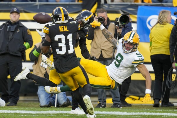 Pittsburgh Steelers' Keanu Neal intercepts a pass intended for Green Bay Packers' Christian Watson during the second half of an NFL football game Sunday, Nov. 12, 2023, in Pittsburgh. (AP Photo/Gene J Puskar)