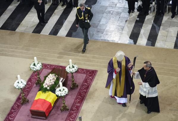 Ghent Bishop Luc Van Looy, center, presides over the funeral service of former Belgian prime minister Wilfried Martens at the Saint-Bavo's Cathedral in Ghent, Belgium on Saturday, Oct. 19, 2013. One of Pope Francis' proposed new cardinals, the retired bishop of Ghent, Belgium, has bowed out of accepting the honor over his insufficient response to cases of clergy sexual abuse, the Belgian bishops conference said. Ghent Bishop Luc Van Looy had asked Francis to decline the honor "to not harm victims again," and Francis accepted the request, the bishops said in a statement Thursday. (AP Photo/Yorrick Jansens, Pool, File)