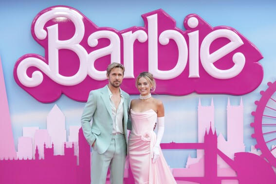 FILE - Ryan Gosling, left, and Margot Robbie pose for photographers upon arrival at the premiere of the film 'Barbie' on July 12, 2023, in London. “Barbie” is set to open across the Middle East on Thursday, Aug. 10, but moves by Kuwait and Lebanon to ban the film — apparently over it's alleged LGBTQ themes — has raised questions over how widely it will be released. (Scott Garfitt/Invision/AP, File)