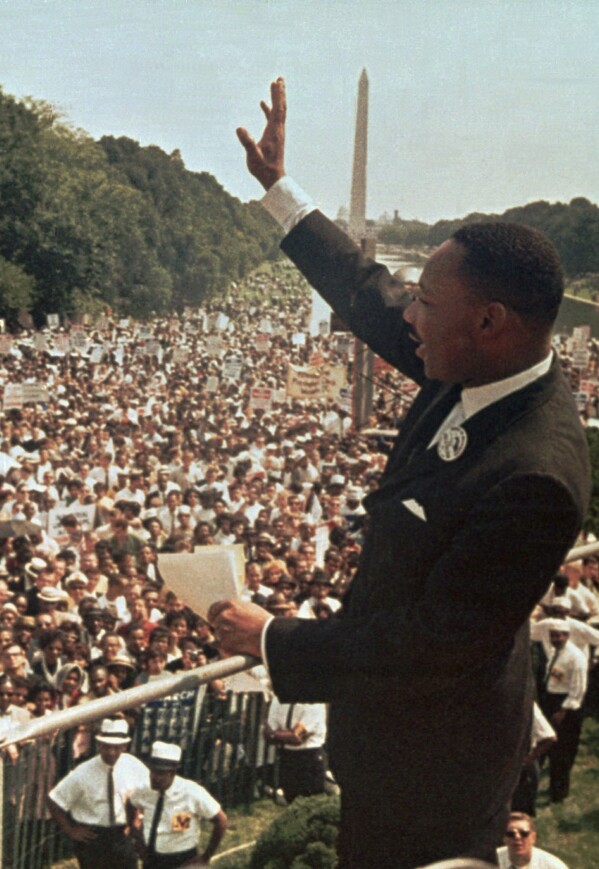 FILE - The Rev. Martin Luther King, Jr. acknowledges the crowd outside the Lincoln Memorial for his "I Have a Dream" speech during the March on Washington on Aug. 28, 1963. (AP Photo/File)