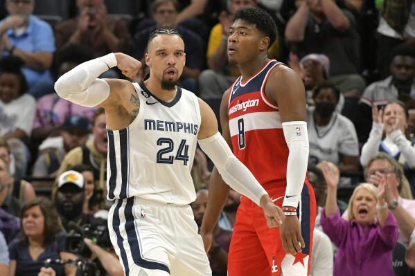 Memphis Grizzlies forward Dillon Brooks (24) reacts after scoring ahead of Washington Wizards forward Rui Hachimura (8) in the second half of an NBA basketball game Sunday, Nov. 6, 2022, in Memphis, Tenn. (AP Photo/Brandon Dill)