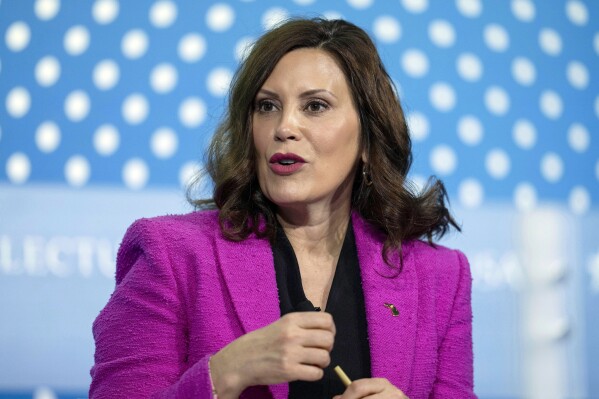 FILE - Michigan Gov. Gretchen Whitmer speaks at the SelectUSA Investment Summit, May 4, 2023, in Oxon Hill, Md. Campaigns will be required to clearly state that political advertisements airing in Michigan were created with the use of artificial intelligence under legislation expected to be signed in the coming days by Whitmer. The use of AI-generated deepfakes within 90 days of an election will be prohibited without a disclosure identifying the media as manipulated. (AP Photo/Alex Brandon, File)