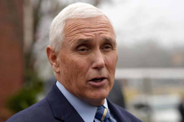 FILE - Former Vice President Mike Pence speaks with reporters Dec. 6, 2022, at Garden Sanctuary Church of God in Rock Hill, S.C. The executive director of former U.N. Ambassador Nikki Haley's political action committee is leaving to help run PAC efforts for Pence.(AP Photo/Meg Kinnard, File)