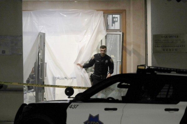 San Francisco police investigate at the Chinese consulate in San Franciso on Monday, Oct. 9, 2023. Officials said a car rammed into the consulate building Monday, coming to a stop in the lobby and creating a chaotic scene that ended with police shooting the driver, who later died at the hospital. (Jane Tyska/Bay Area News Group via AP)