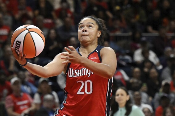 FILE - Washington Mystics guard Kristi Toliver (20) goes to the basket for a lay up during the second half of a WNBA basketball game against the New York Liberty, Friday, May 19, 2023, in Washington. The Phoenix Mercury have hired three-time WNBA All-Star and former NBA assistant Kristi Toliver as associate head coach. Toliver will join the staff of first-year coach Nate Tibbetts in the hiring announced on Friday, Dec. 1, 2023.(AP Photo/Terrance Williams, File)