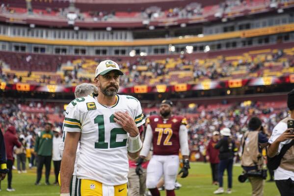 Green Bay Packers quarterback Aaron Rodgers walks off the field after an NFL football game against the Washington Commanders, Sunday, Oct. 23, 2022, in Landover, Md. The Commanders won 23-21. (AP Photo/Patrick Semansky)