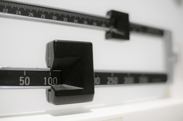 FILE - This Tuesday, April 3, 2018 file photo shows a closeup of a beam scale in New York. High-dose oral versions of the medication in the weight-loss drug Wegovy may work as well as injections at paring pounds and improving health, including hard-to-treat people with diabetes, according to research released Sunday, June 25, 2023. (AP Photo/Patrick Sison, File)